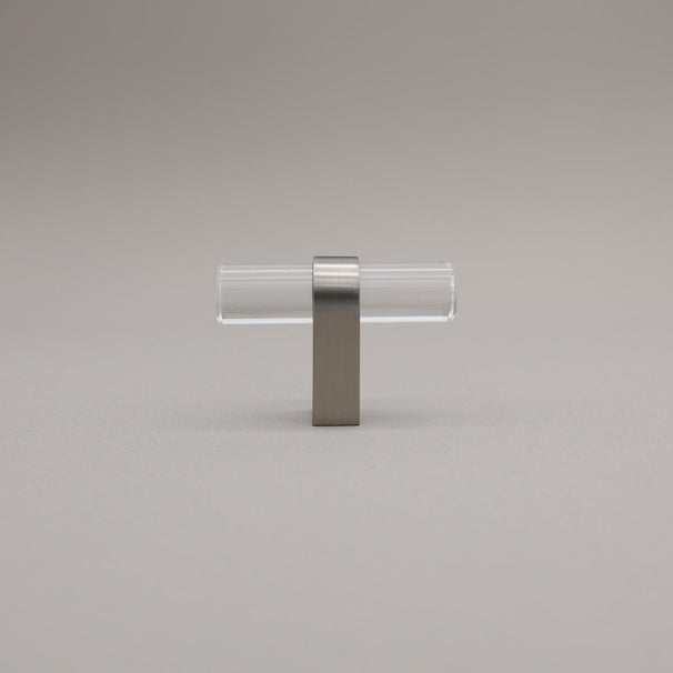 Clear acrylic and satin nickel stem knob on gray background