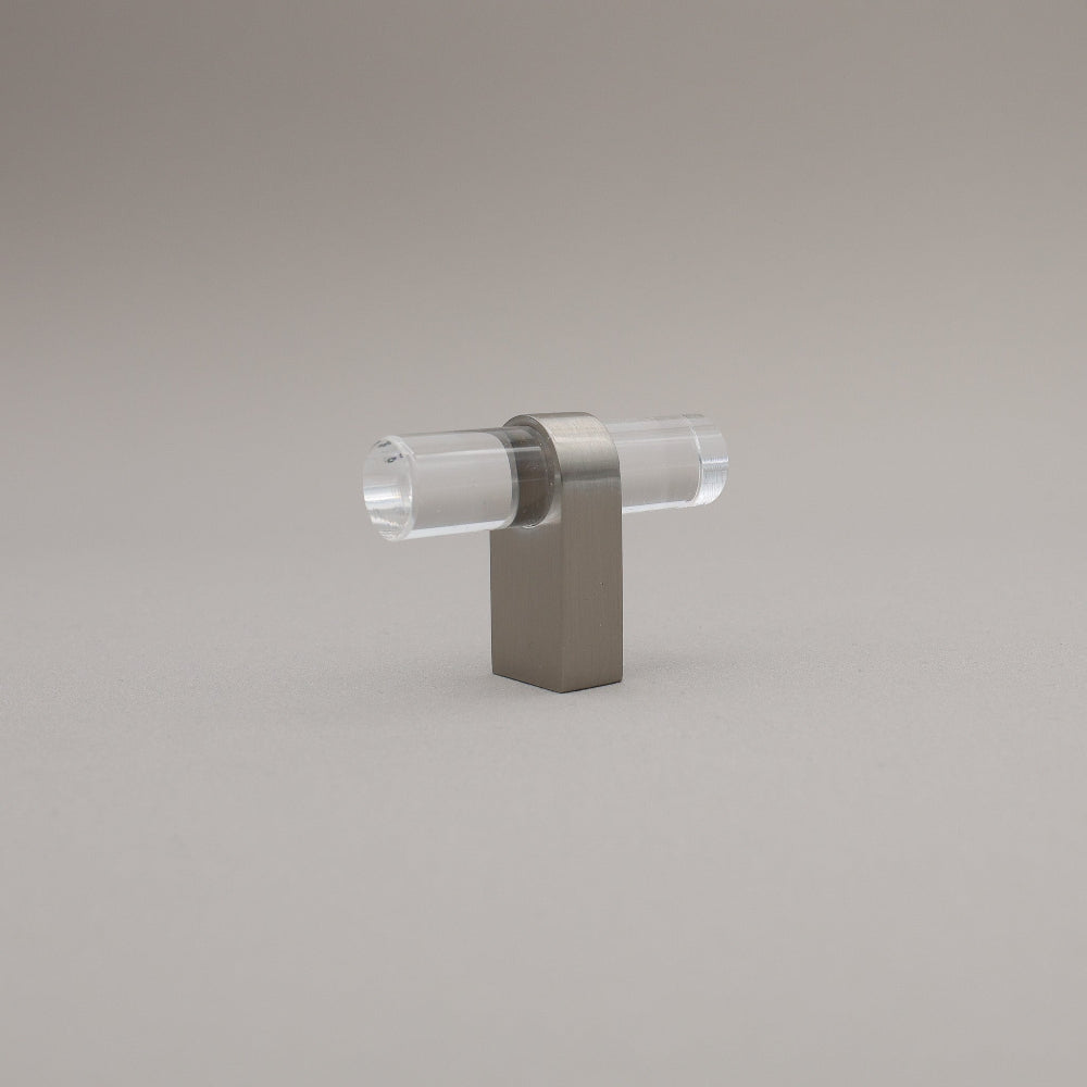 Clear acrylic and satin nickel stem knob on gray background