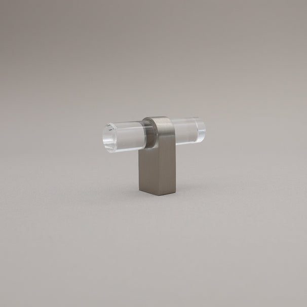 Clear acrylic and satin nickel stem knob on gray background