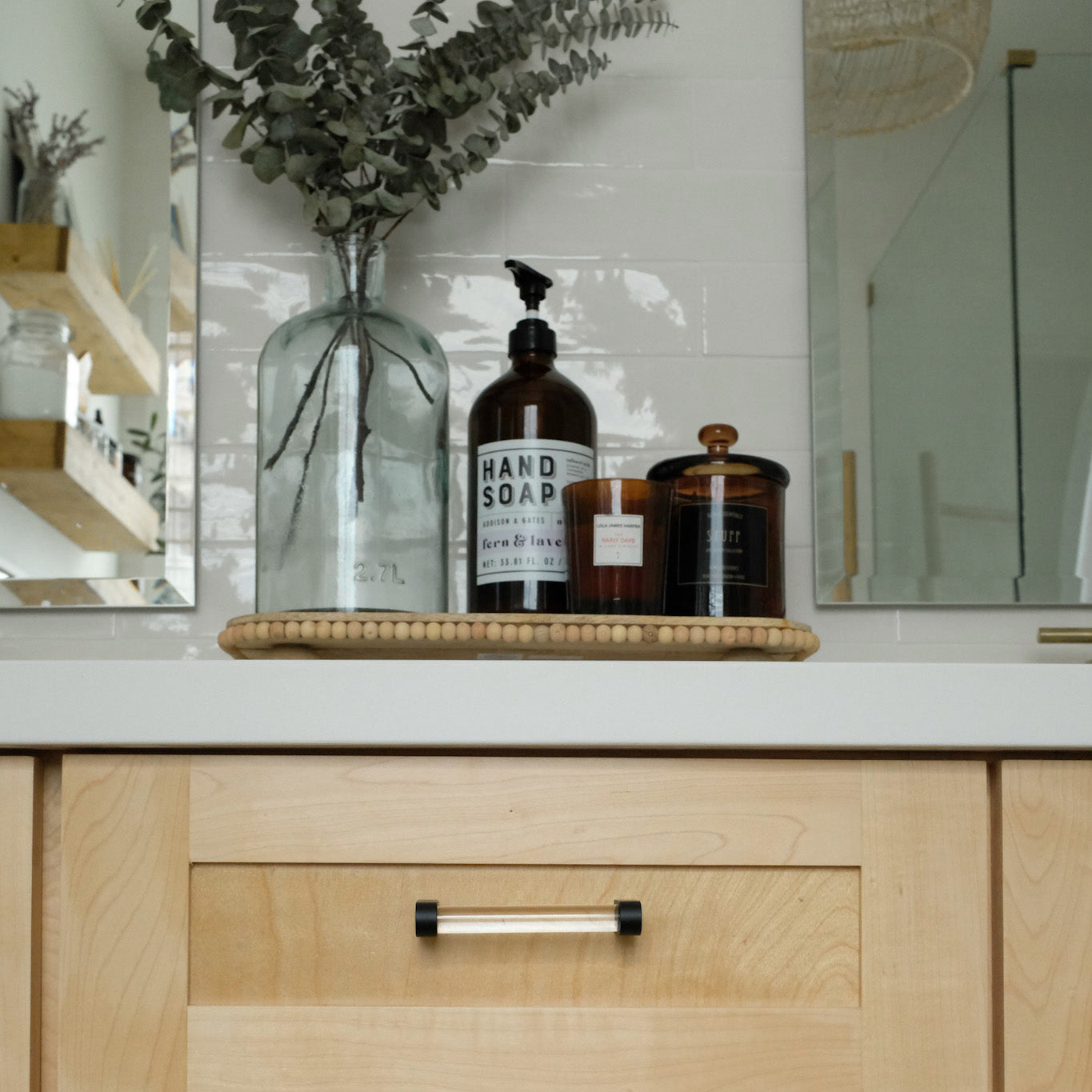 Black acrylic cabinet handles for the bathroom. 