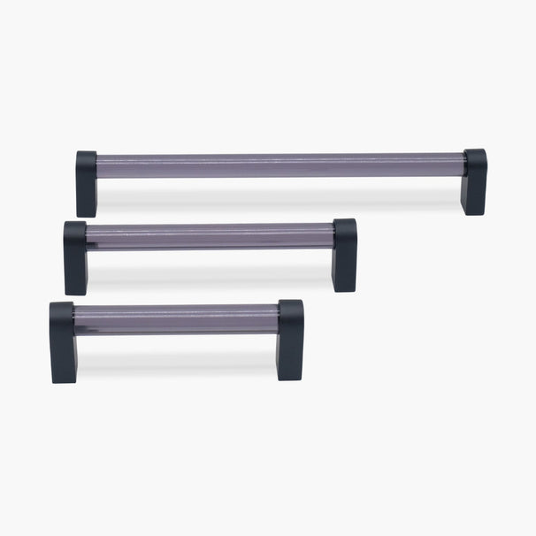 three smoke and black acrylic cabinet pulls in three sizes on white background