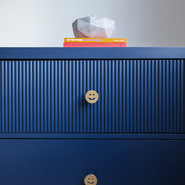 Smiley Gold Designer Brass Knob on Blue Dresser