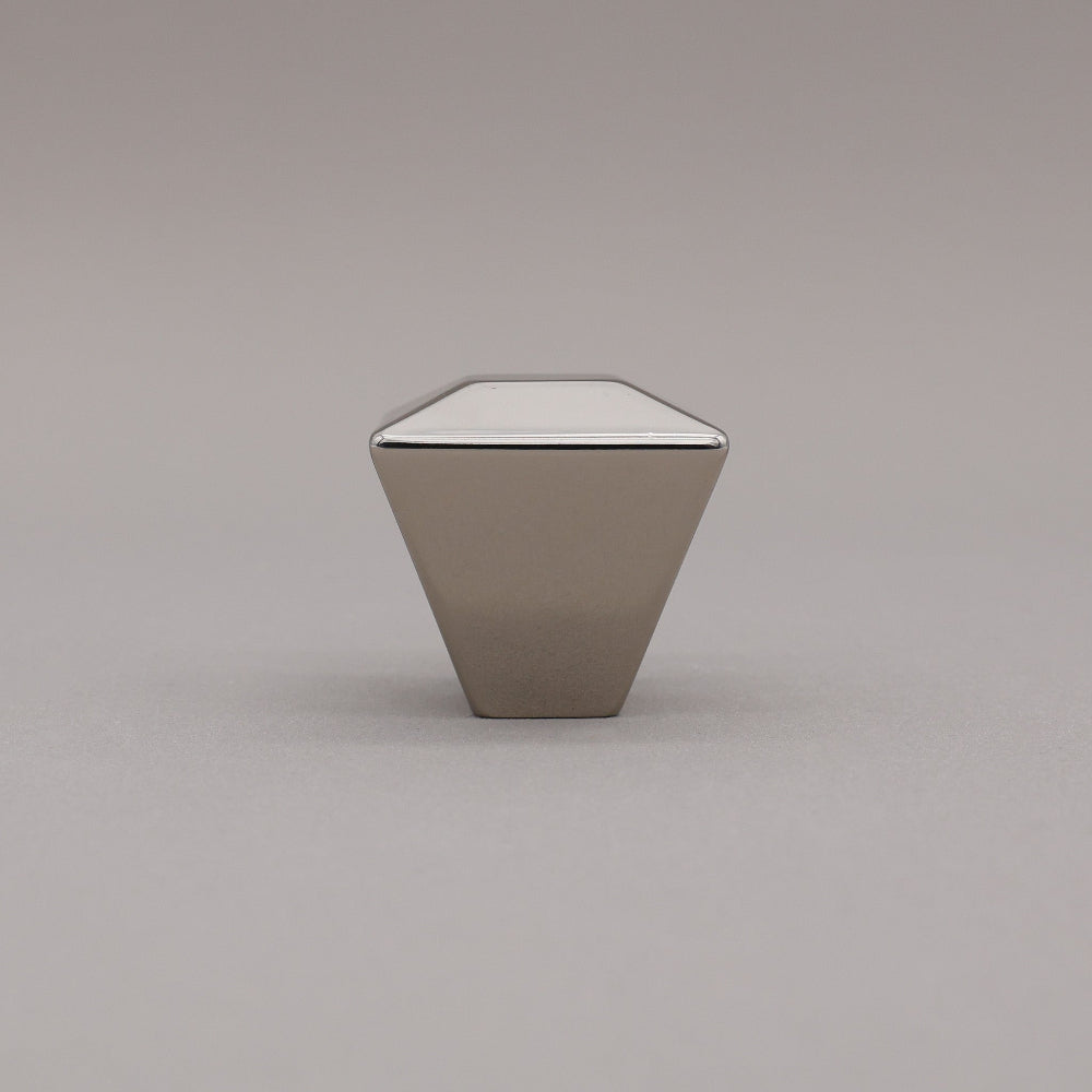 polished nickel geometric diamond knob on a gray background standing