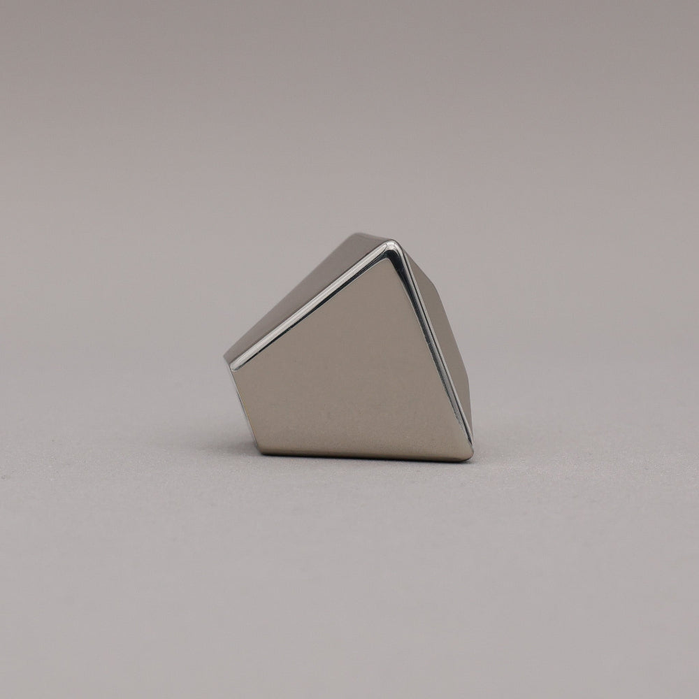 polished nickel geometric diamond knob on a gray background side view