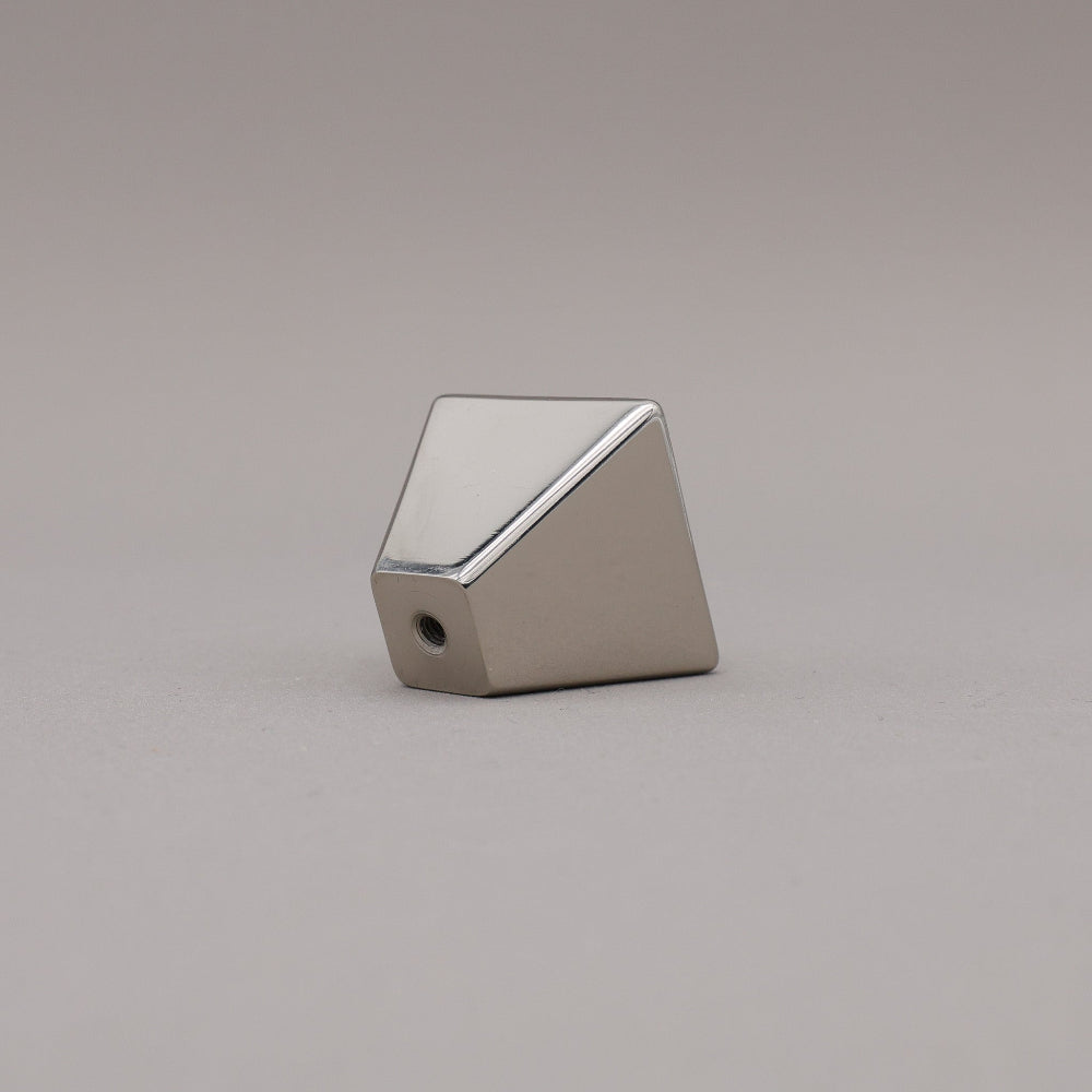 polished nickel geometric diamond knob on a gray background
