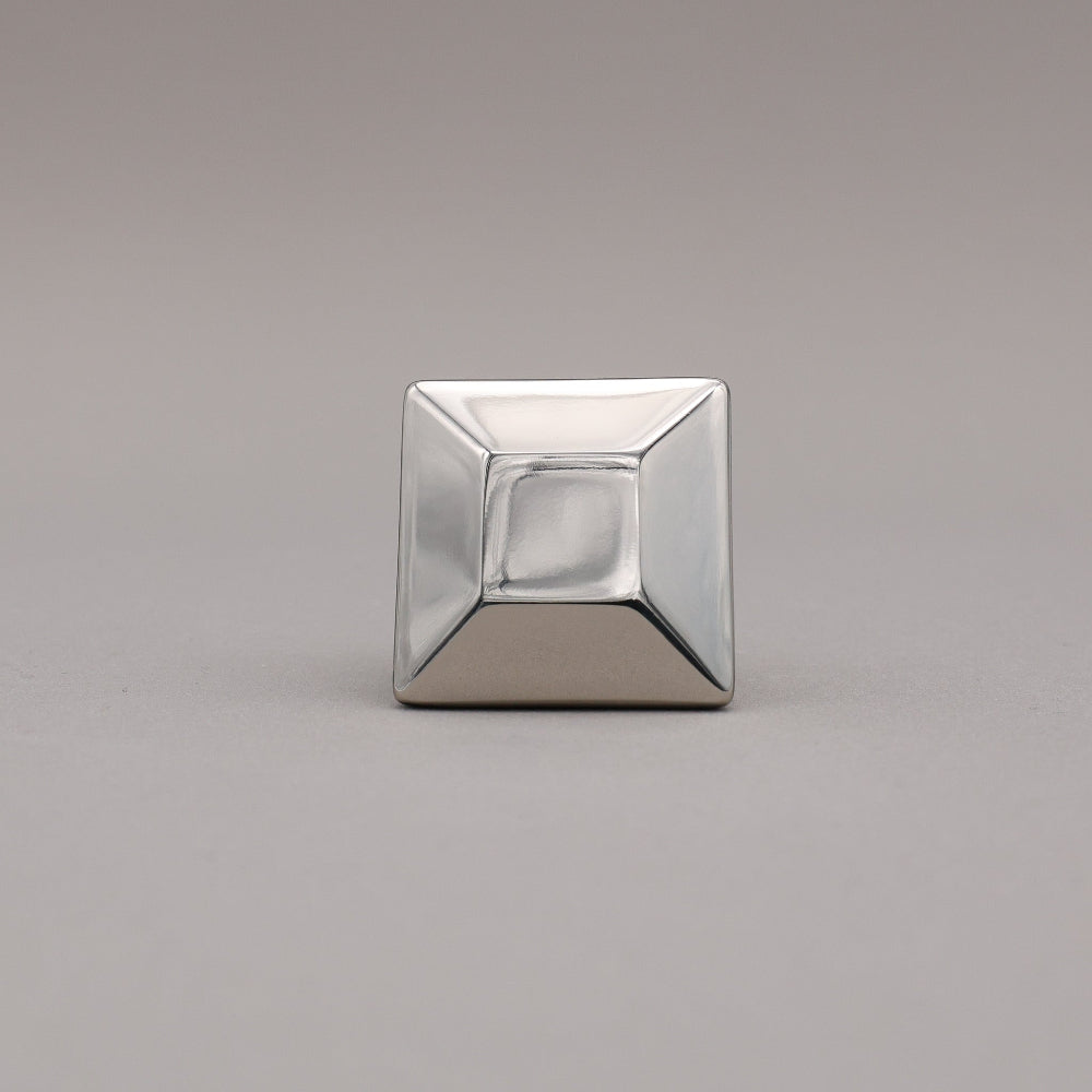 polished nickel geometric diamond knob on a gray background