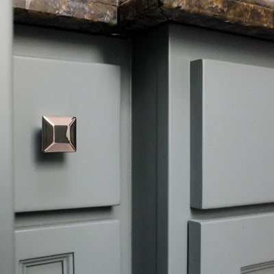 Modern Diamond Cabinet Knob in Polished Nickel on Blue Bathroom Vanity Drawer