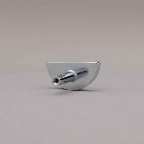 half moon polished chrome knob on gray background rear view