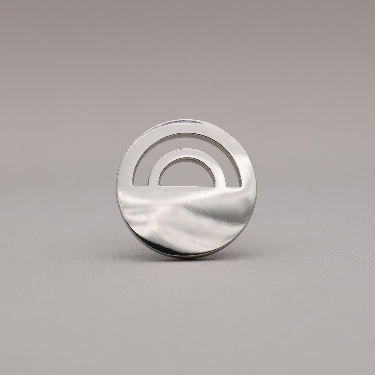 Horizon Polished Nickel Knobs on grey background.
