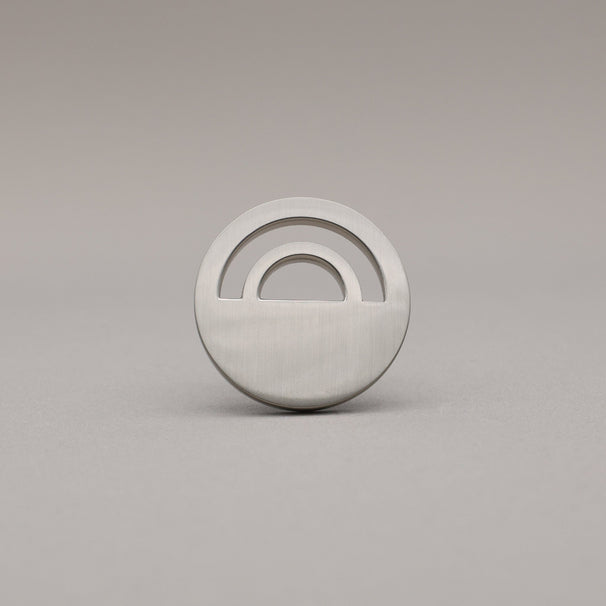 Horizon Satin Nickel Knobs on grey background.