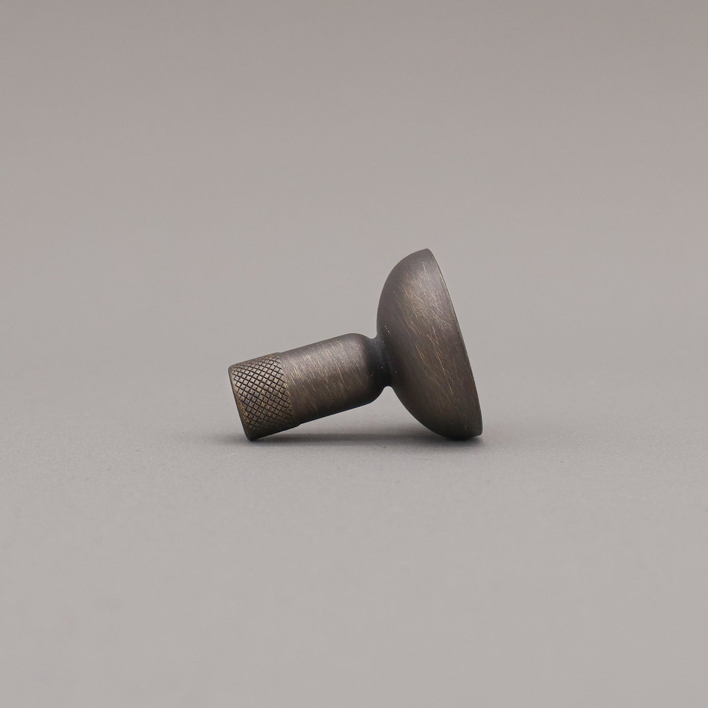 Metallic knob on a gray background