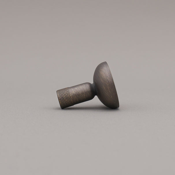 Metallic knob on a gray background