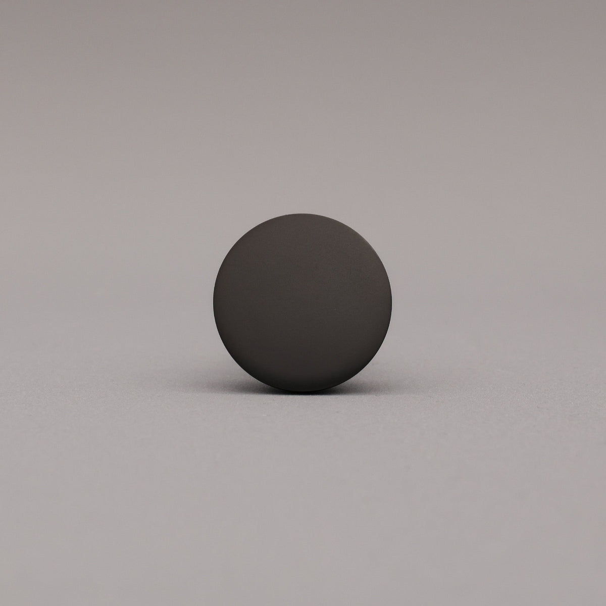 Black sphere on a gray background