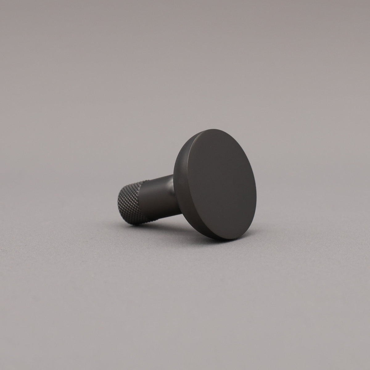 Black knob on a gray background