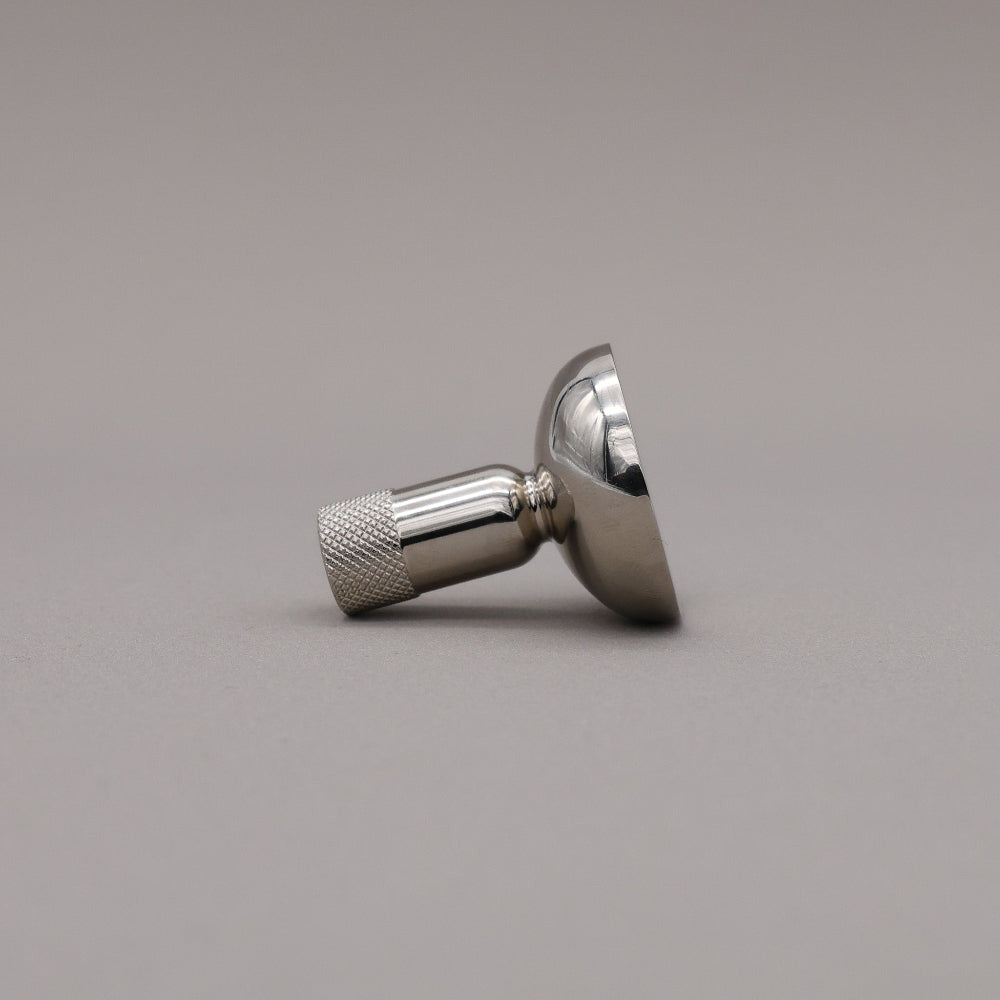 Metallic knob on a gray background