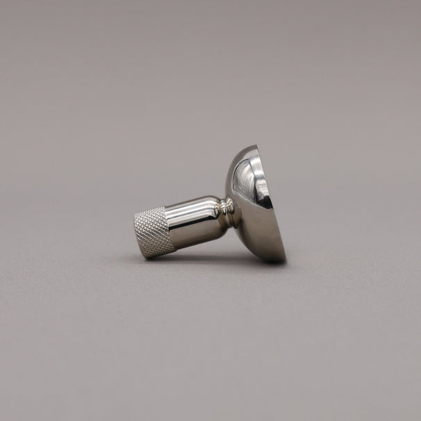Metallic knob on a gray background