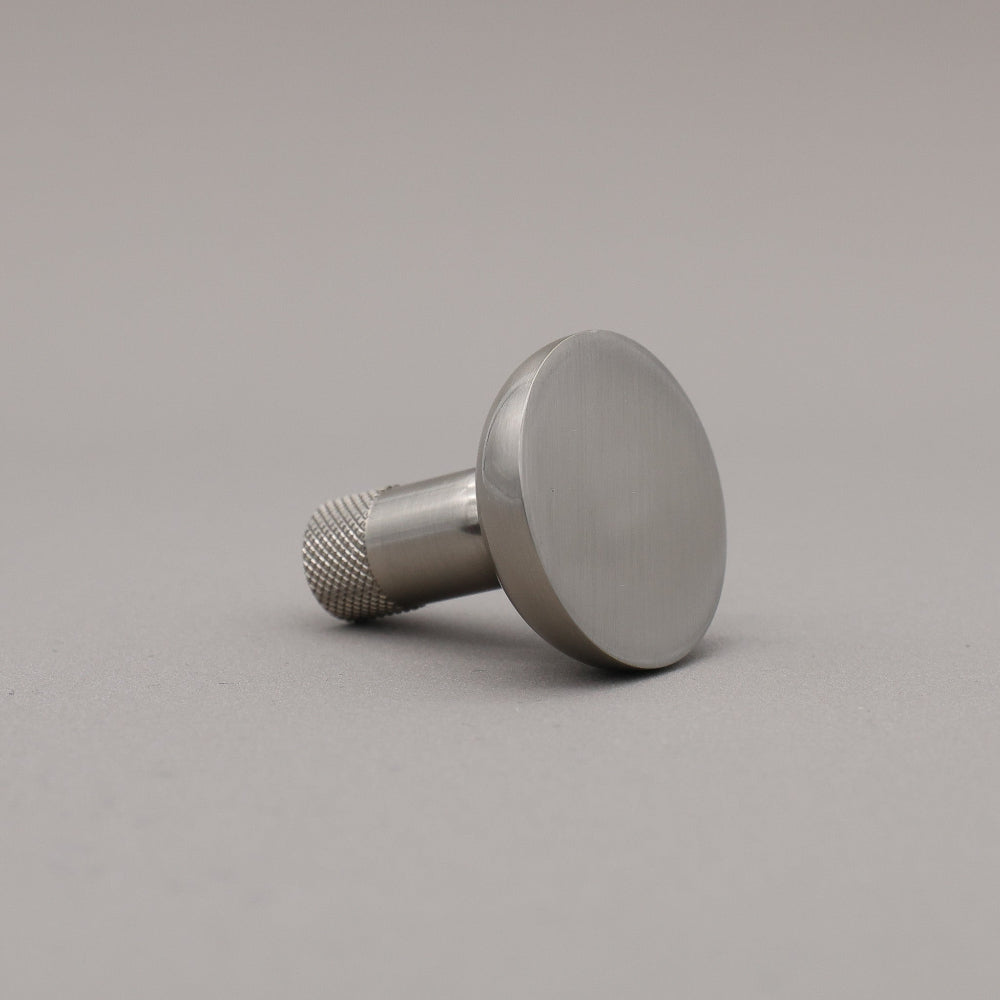 Metal knob on a gray background