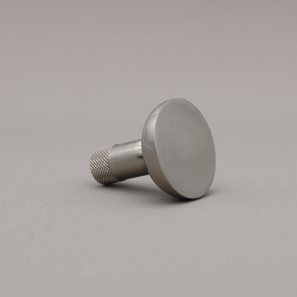 Metal knob on a gray background