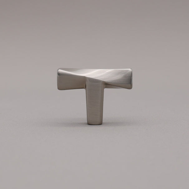 Satin nickel knob on a gray background twist. 