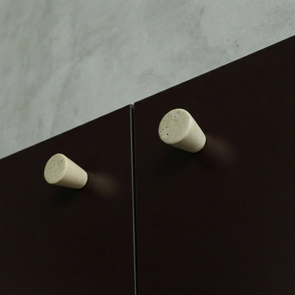 Marble knobs finished in a Travertine on Burgundy cabinets.