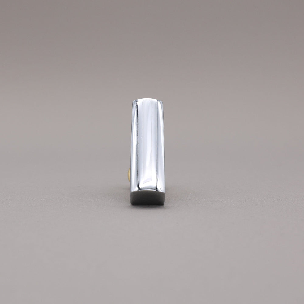 Front facing satin brass and polished chrome t-knob brass cabinet knob on gray background.