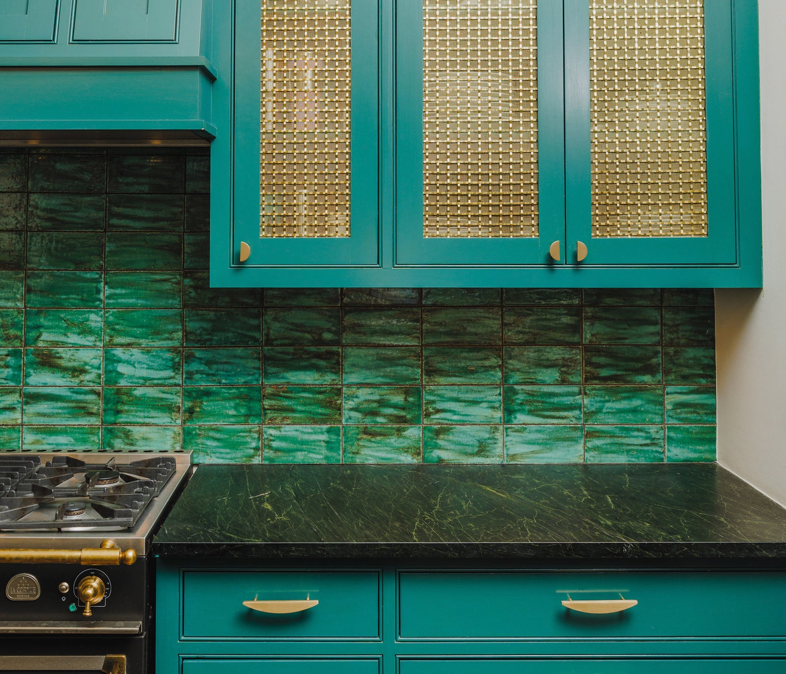 Semi-circle cabinet handles on kitchen drawers.