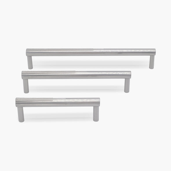 Three cabinet pulls in polished nickel from the sunburst collection