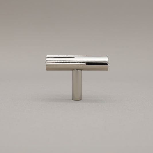 Satin Nickel art deco knob on a gray background.