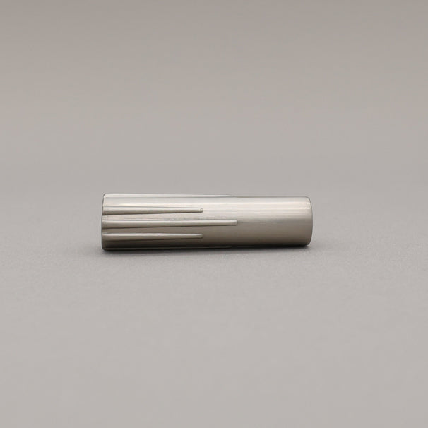 Satin nickel silver t-knob on a gray background