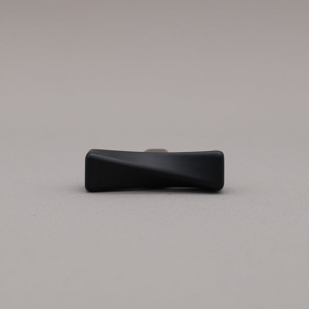 Black twisted knob on a gray background