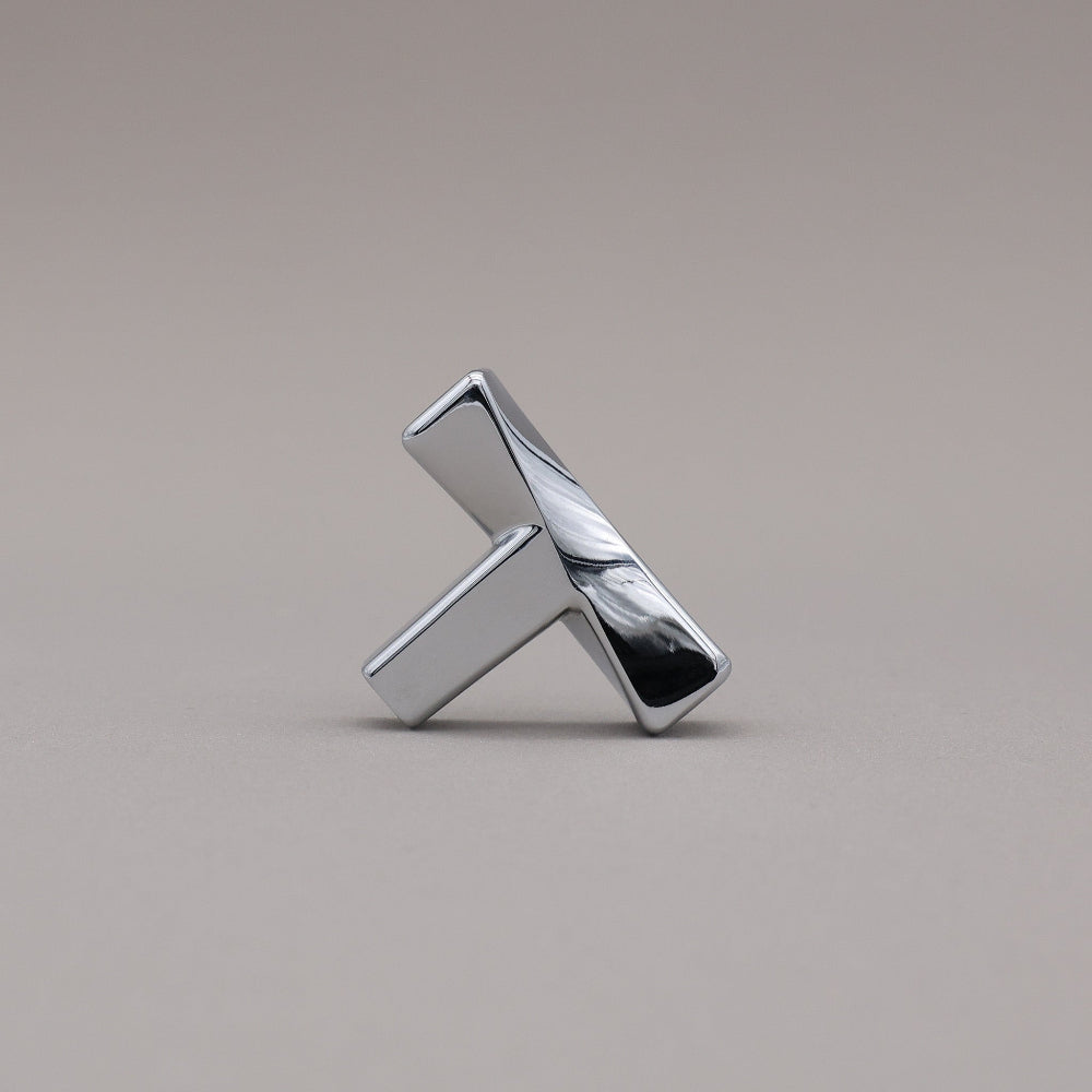 Polished chrome twisted knob leaning.