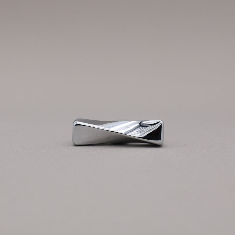 Polished Chrome Knob with a wavy design on a gray background