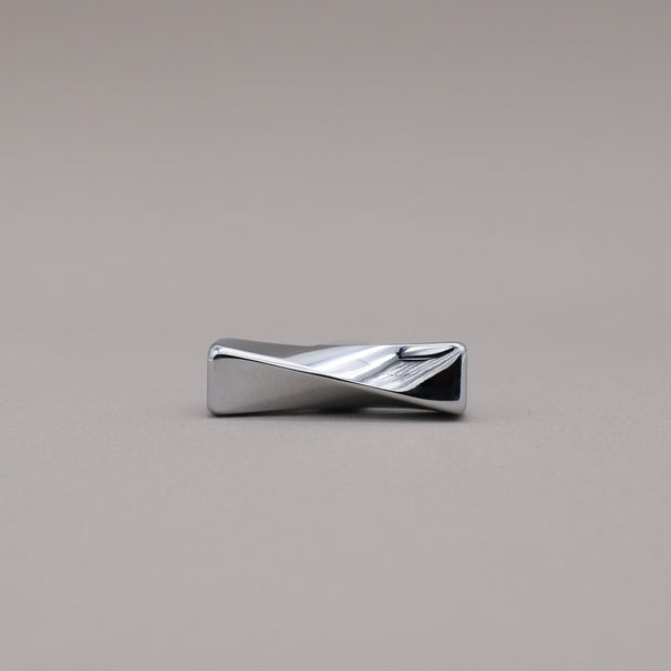 Polished Chrome Knob with a wavy design on a gray background
