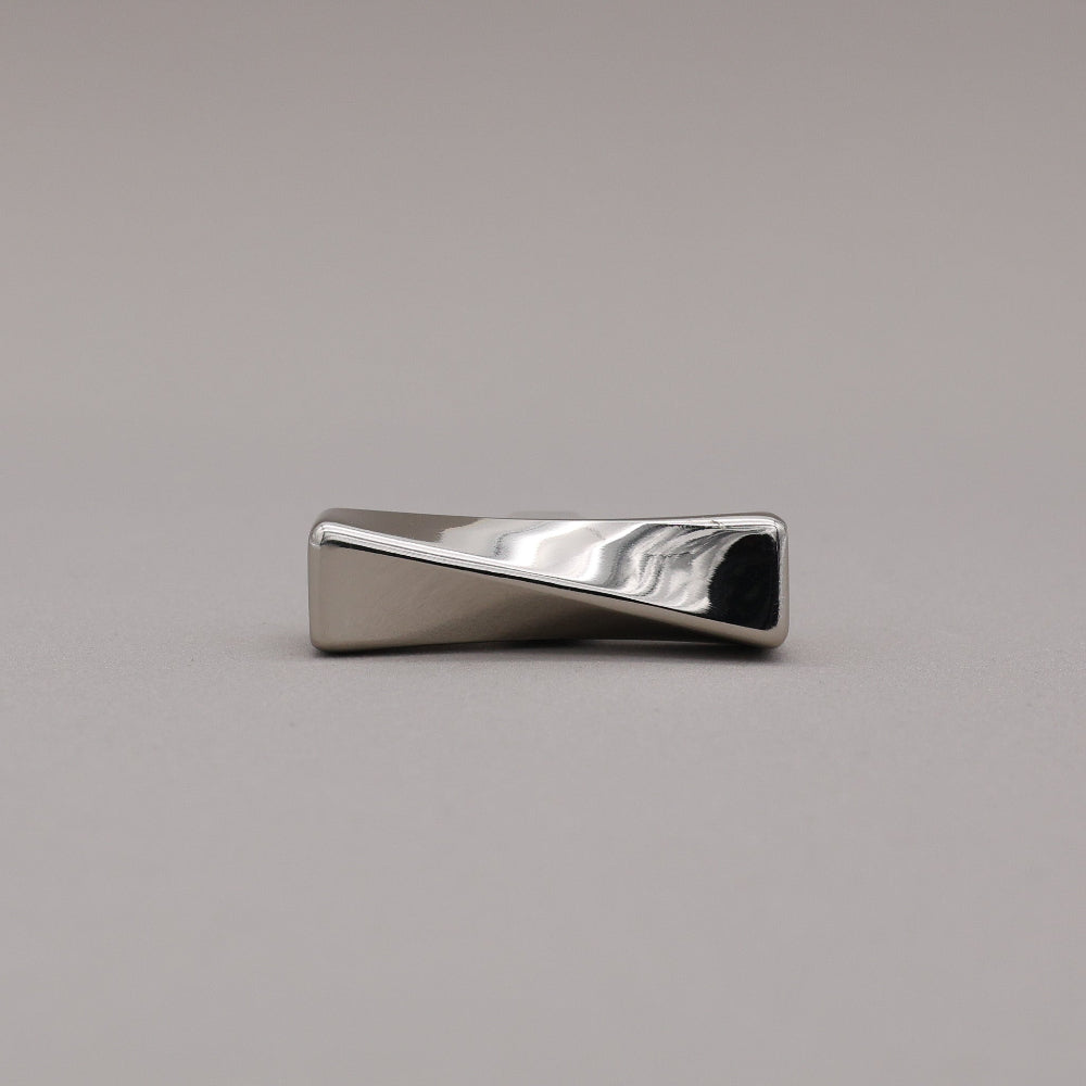 Polished nickel finished twist cabinet knob on gray background.