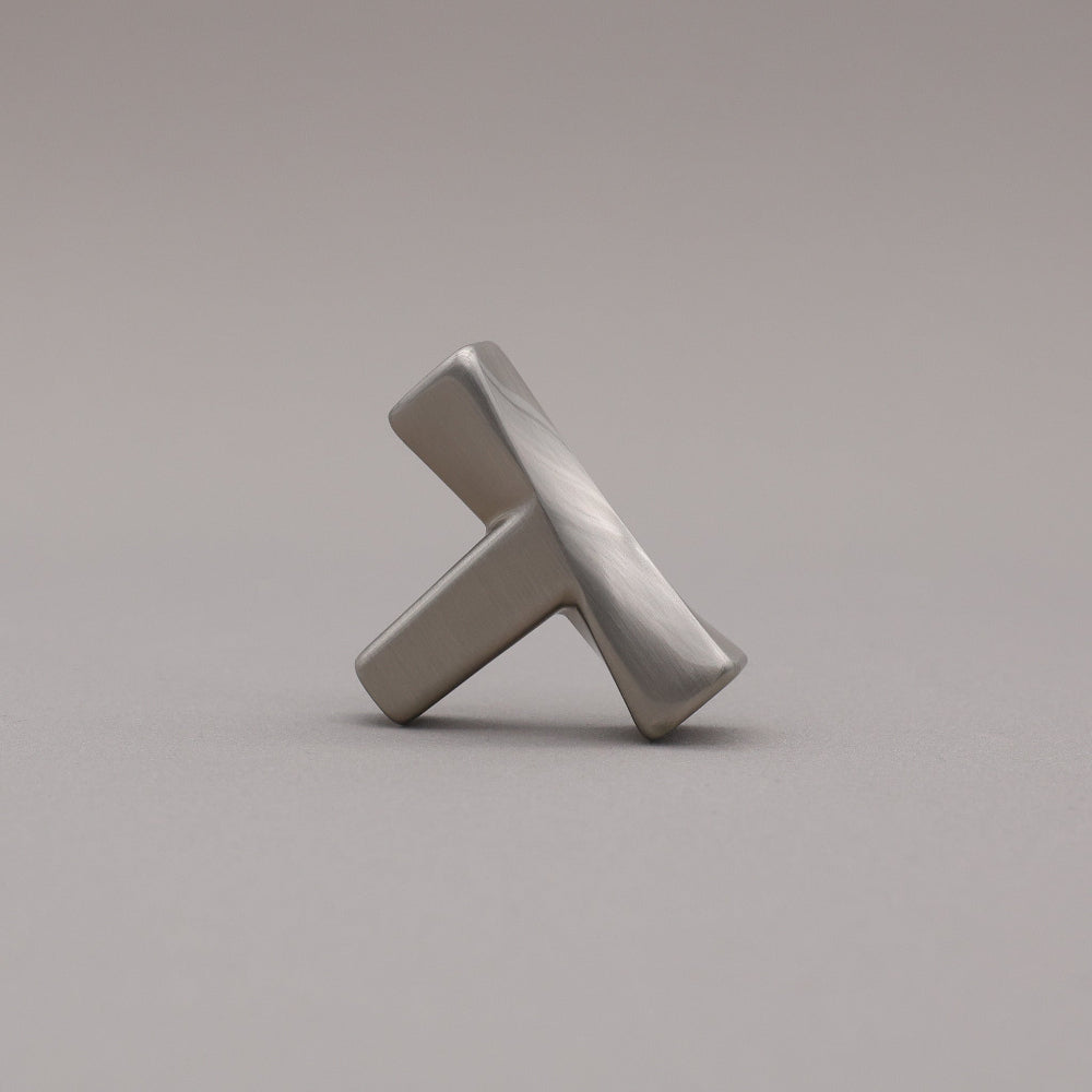 Satin Nickel T-shaped knob on a gray background
