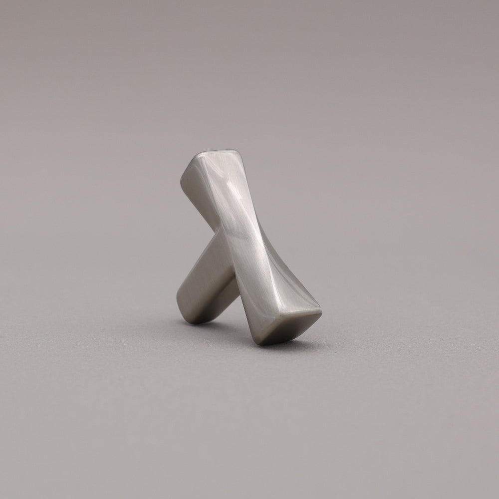 Satin Nickel T-shaped knob on a gray background