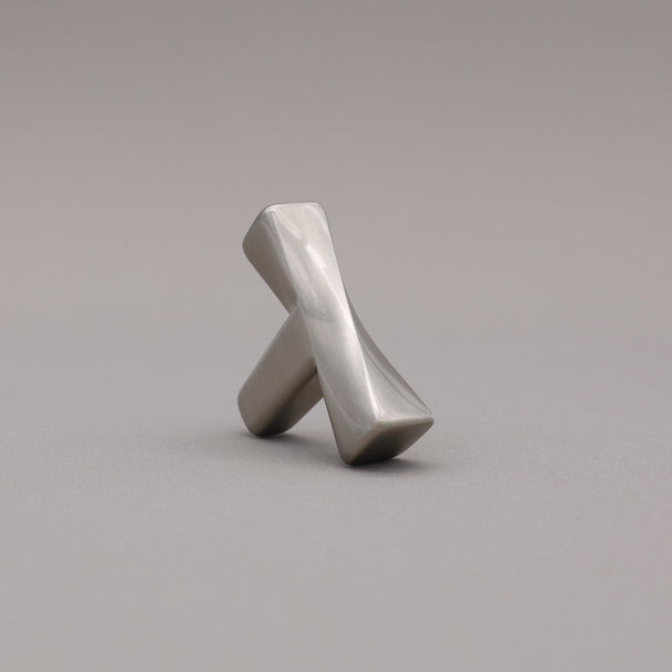 Satin Nickel T-shaped knob on a gray background