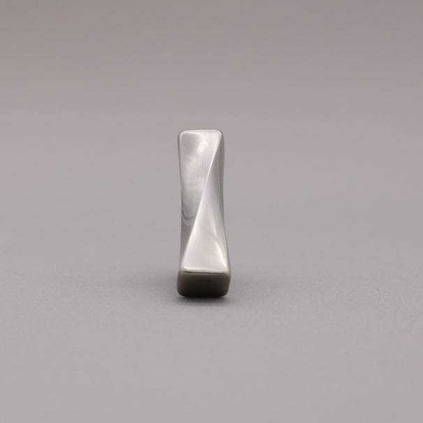 Satin Nickel T-shaped knob on a gray background