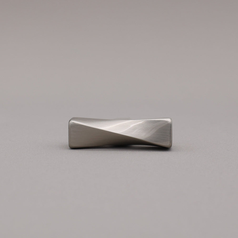 Satin Nickel T-shaped knob on a gray background