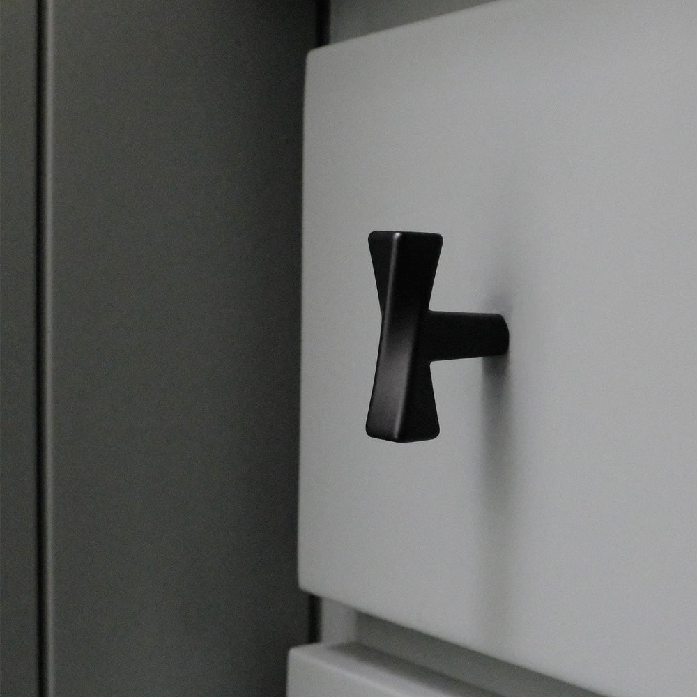 Matte Black twist knob on blue drawer. 