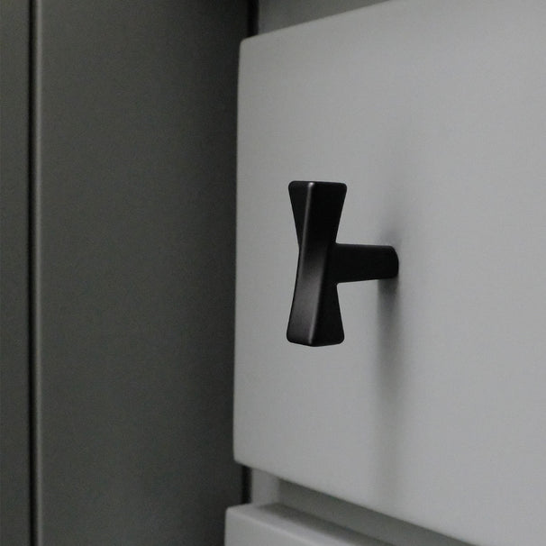 Matte Black twist knob on blue drawer. 