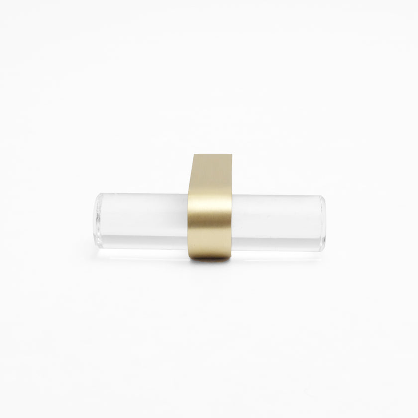 Front-facing, laying down view of Clarity T-Knob in Clear Acrylic and Satin Brass finish