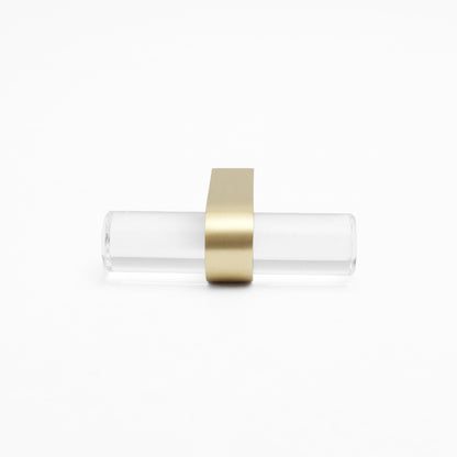 Front-facing, laying down view of Clarity T-Knob in Clear Acrylic and Satin Brass finish