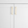 Two Diamond 4" center to center cabinet pulls in  Satin Brass installed on white cabinet doors