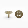 Two Satin Brass Smiley knobs, one standing and one front-facing while laying down