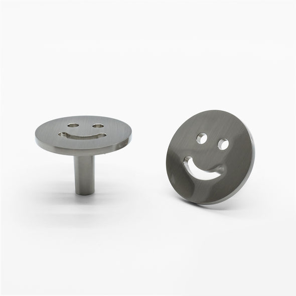 Two Satin Nickel Smiley knobs, one standing and one angled and laying down