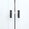 Two Hapny Sunburst t-knobs in a Venetian Bronze finish installed on white cabinet doors