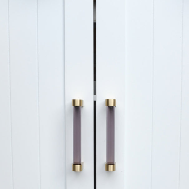 Two Clarity 96mm center to center cabinet pulls in Smoke Acrylic and Satin Brass installed on white cabinet doors